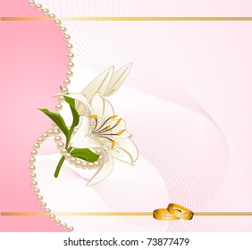 Two wedding rings on a background with lillies