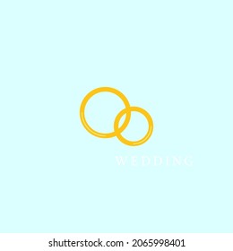 Two wedding rings and a white inscription on a clear sky background