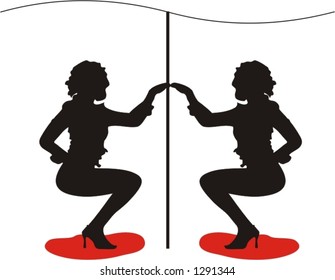 two well defined striptease girls performing half nude on the stage - disco dancers