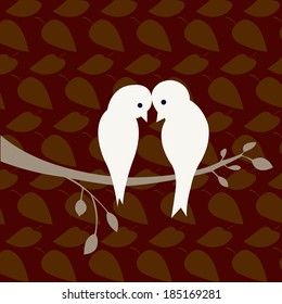 Two white birds on the tree.
