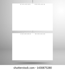 Two white blank calendars or notebooks on a spiral hangs on a thread. Realistic mockup for design with shadows