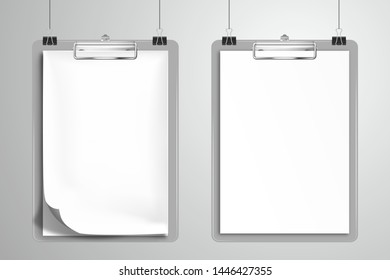 Two white blank notebooks is clamped in the clipboards and hanging on the clips. Mockup for design