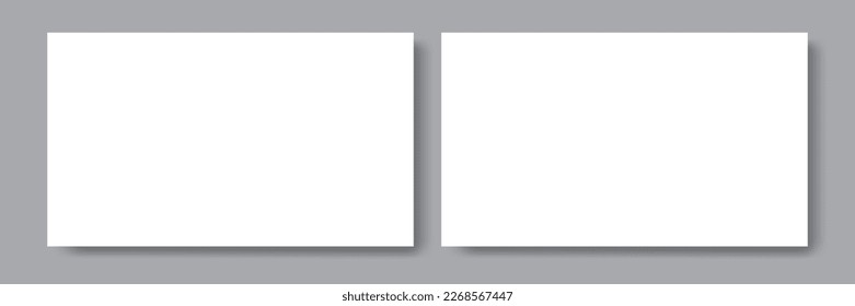 Dos papeles blancos en blanco con sombras en el fondo gris. Plantillas para la presentación del diseño. Maquina para la tarjeta de visita o volante, portada, afiche. modelo de diseño.