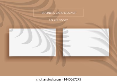 Two White Business cards Mockup. Natural lighting overlays shadows on top. Scene of Tropical Leaf Shadows from the window. A palm leaves. Photo-realistic vector illustration. Cards 2x3.5 inch.