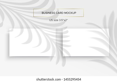 Two White Business cards Mockup. Natural lighting overlays shadows on top. Scene of Tropical Leaf Shadows from the window. A palm leaves. Photo-realistic vector illustration. Cards 2x3.5 inch.