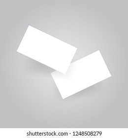 Two white business cards on a gray background. Vector illustration .