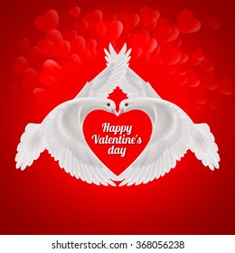 Two white doves the shape of the wings of the red heart. Love symbol