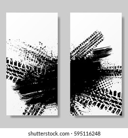 Two white posters with bck tire track and ink splash