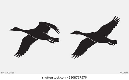 Two wild geese flying high in the sky black bird vector silhouettes isolated graphic