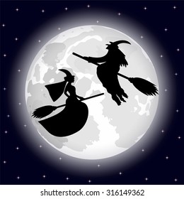 two witches on a background of the full moon on Halloween night