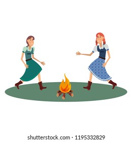 two woman dancing with bonfire