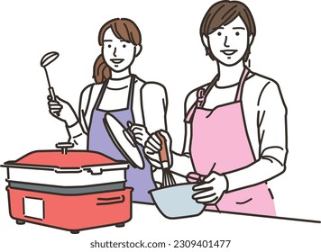 Two women in aprons cooking in the kitchen
