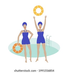Two women by the swimming pool with swim rings. Blue retro swimwear and swim caps.