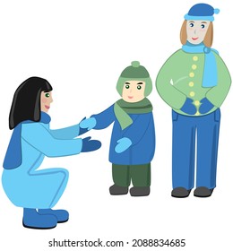 Two women and a child in winter clothes.
