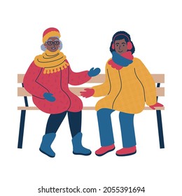 Two women of different age in warm winter coats sitting on a bench and having a friendly conversation. Cosy outdoor winter scene. Flat style isolated vector illustration.