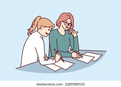 Two women doing paperwork sitting at table in office of insurance company during conclusion of contract. Business women make business plan for new project wish to create successful startup together