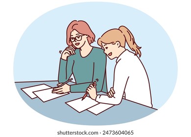 Two women doing paperwork sitting at table in office of insurance company during conclusion of contract. Business women make business plan for new project wish to create successful startup together