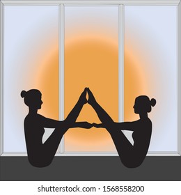 Two women doing yoga by the window, behind which the sun shines.