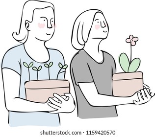 Two women is holding a pot of plant, New life concept.