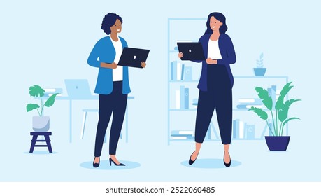 Two women with laptops - Female vector characters standing holding computers in office work setting, smiling and talking together. Flat design illustration with light blue background