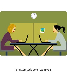 Two women in the office with laptops