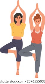 Two women are performing the tree pose, a balancing asana in yoga, promoting stability, focus, and inner peace, with hands joined above their heads and one leg resting on the opposite thigh