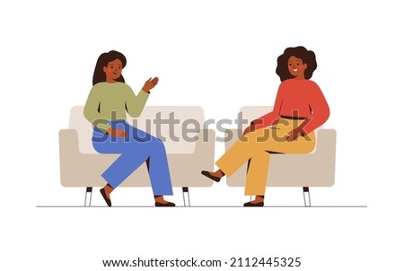 Two women sit on the couches and  talk about something.  Female host listening to her guest story-telling. Psychotherapist has a session with her patient.  Business interview and Conversation concept.