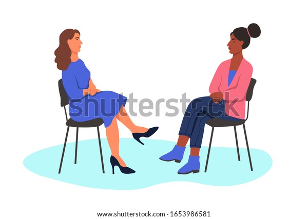 Two Women Sit Opposite Each Other On Chairs. The Concept Of The ...