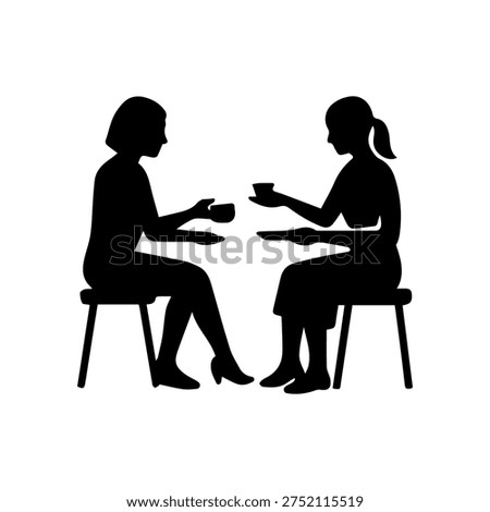 Two women sitting facing each other, drinking beverages, and conversing
