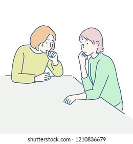 Two women are sitting on the table and are distressed. hand drawn style vector design illustrations.