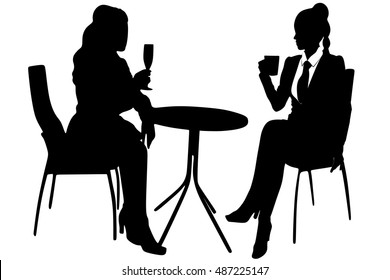 two women talking at bar 