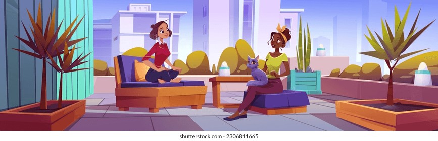 Two women talking on terrace in big city. Vector cartoon illustration of female friends sitting on chairs with cat on lap, urban apartment balcony with cozy furniture and lamps. Cityscape background