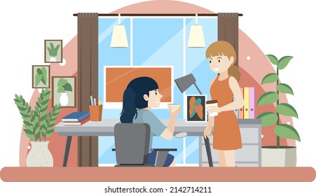 Two women working on computer illustration