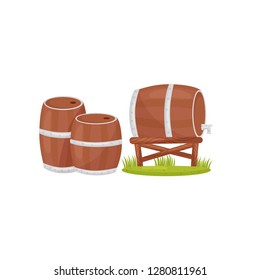 Two wooden barrels on the ground and one barrel with faucet on stand. Farm theme. Flat vector design