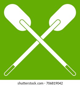 Two wooden crossed oars icon white isolated on green background. Vector illustration