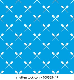 Two wooden crossed oars pattern repeat seamless in blue color for any design. Vector geometric illustration