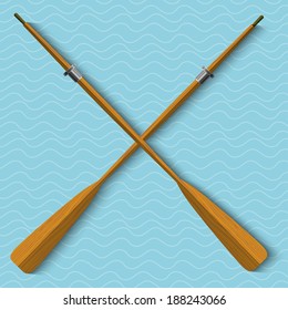 Two Wooden Oars On Wavy Background