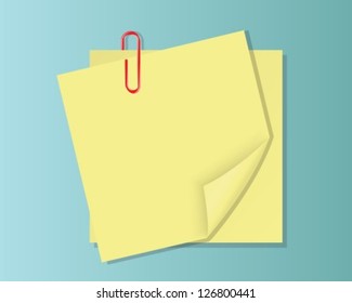 two yellow sheets of paper with a curved edge and redclip