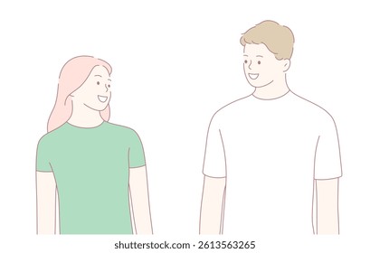 Two young adults are smiling brightly and engaging in a warm and friendly conversation with each other
