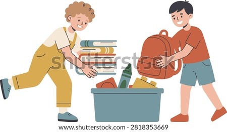 Two young boys are putting school supplies into a bin. One boy places a stack of books into the bin, while the other adds a backpack and crayon.