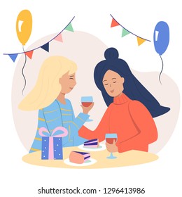Two young girls celebrate birthday.Women sitting at the table, drinking wine, giving present. Holiday card.