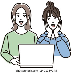 Two young women looking at a laptop