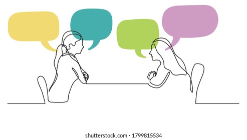 Two Young Women Sitting Behind Table Talking With Speech Bubbles