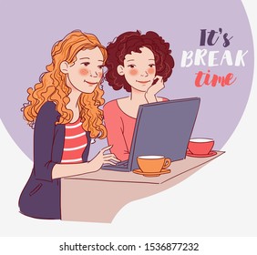 Two young women sitting at the table and looking for something on the Internet 