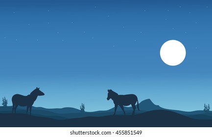 Two zebra silhouettes in hills landscape vector illustration