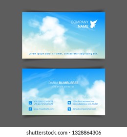 Two-sided horizontal business cards with realistic beige-blue sky and clouds. The image can be used to design a business card.