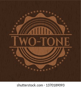 Two-tone badge with wood background