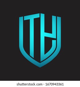 Monograma del logotipo TY con diseño de escudo de emblemas aislado con colores azules sobre fondo negro