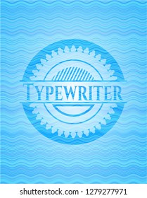 Typewriter light blue water wave style emblem.