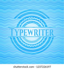 Typewriter sky blue water wave badge.